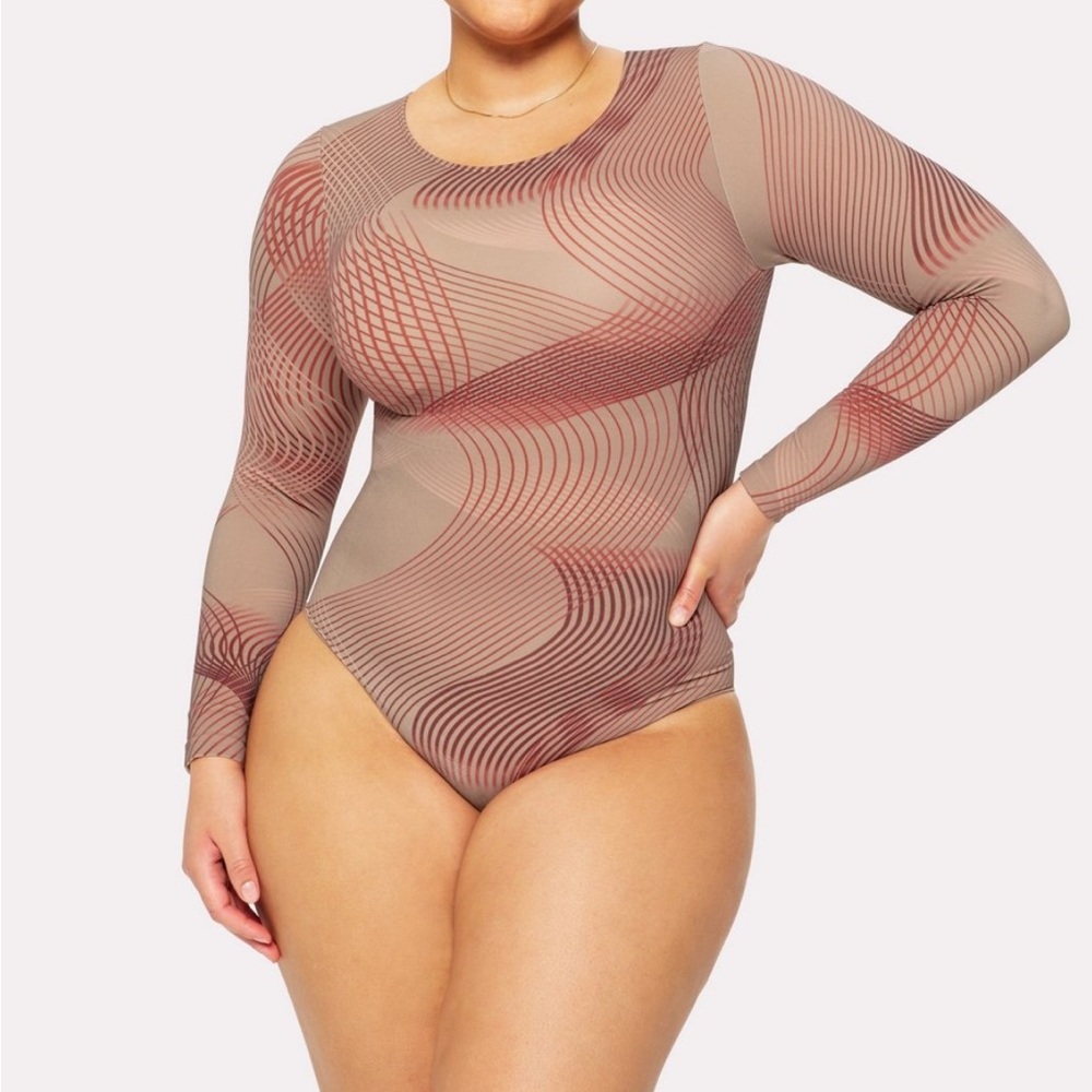 Limited Yitty bodysuit from Fabletics
color: Moody Taupe Swirl
1X/2X